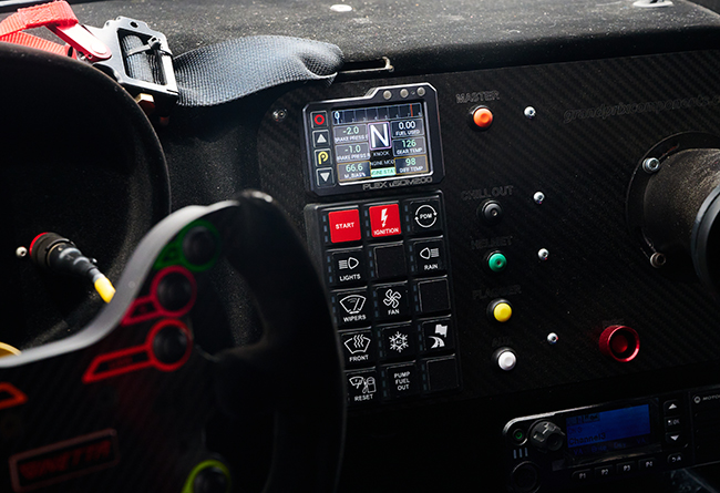 PLEX uSDM-200 Micro Display mounted on the dashboard of a Ginetta G56 GTA race car by 5.2 Motorsports.