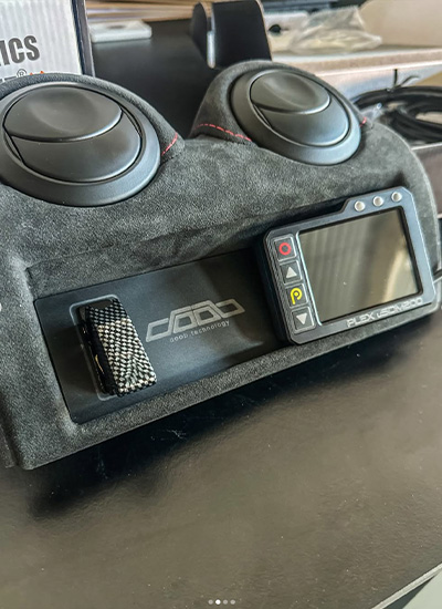 Custom dashboard panel featuring PLEX uSDM-200 Micro Display integrated in a high-performance build Title Attribute: