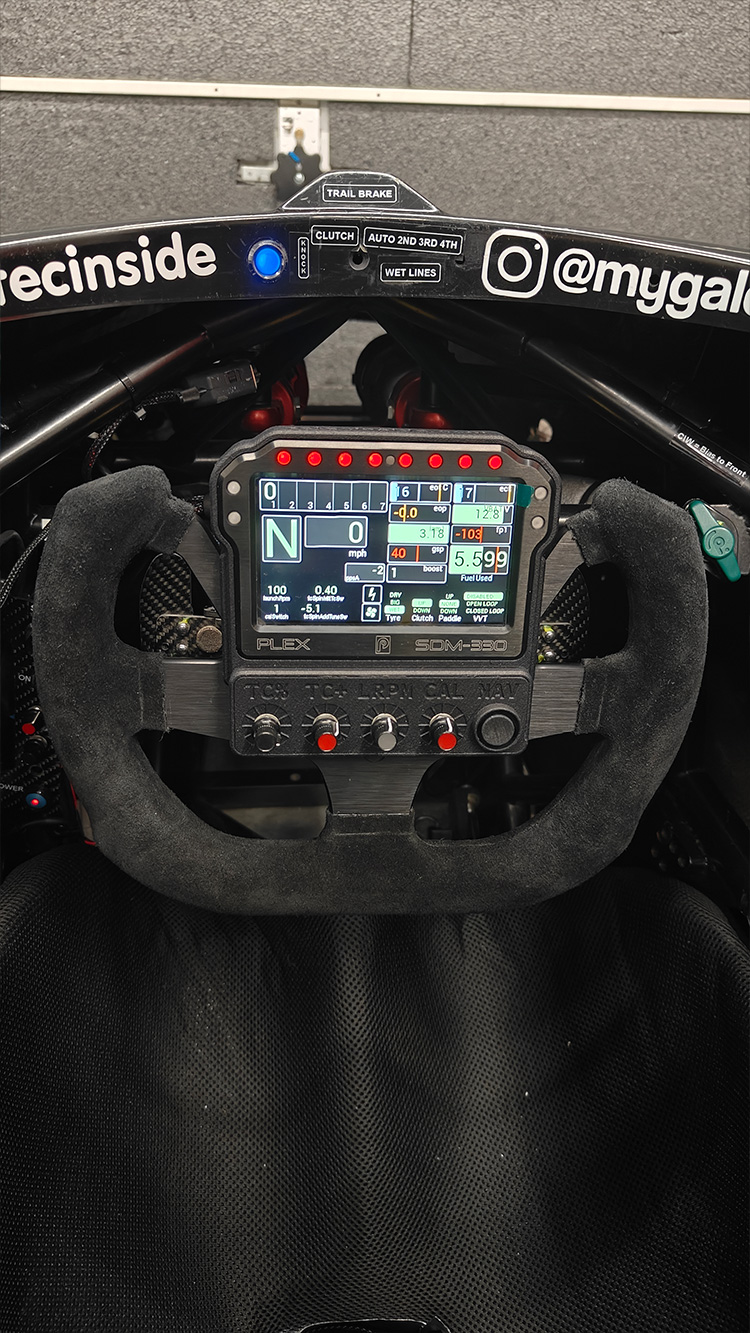 Front view of the SDM-330 display and custom bezel installed on the steering wheel inside Graham Blackwell’s sprint car