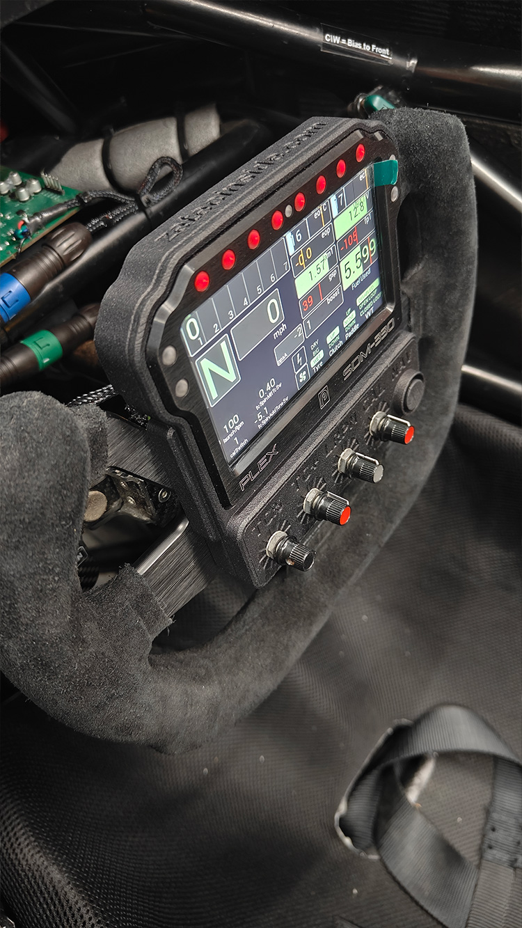 Slight diagonal cockpit view of the SDM-330 display and custom bezel installed in Graham Blackwell’s sprint car
