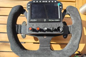 Front view of Graham Blackwell’s steering wheel with installed SDM-330 display and custom bezel