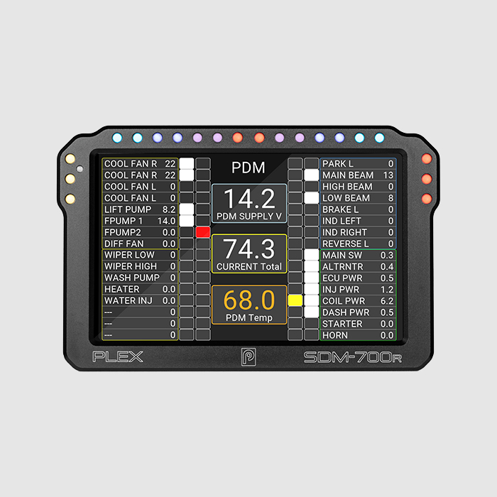 Front view of the PLEX SDM-700R Dash Display Logger showing a page layout for power distribution management with electrical channels, switches, and system status indicators.